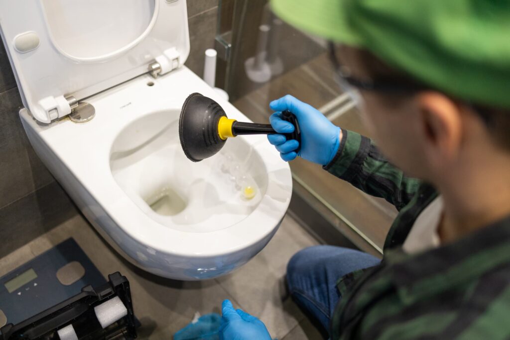 cleaning-toilet-stuck-with-suction-cup-hands-in-g-2025-03-13-00-10-32-utc (1)